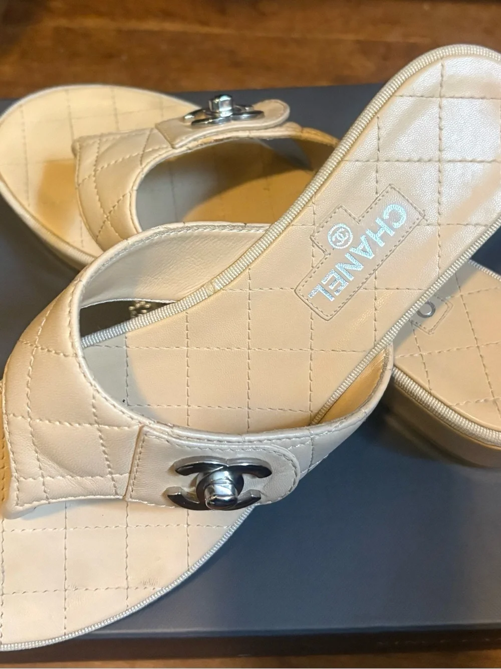 CHANEL Quilted Leather Thong Mules in Cream with Silver CC Logo
